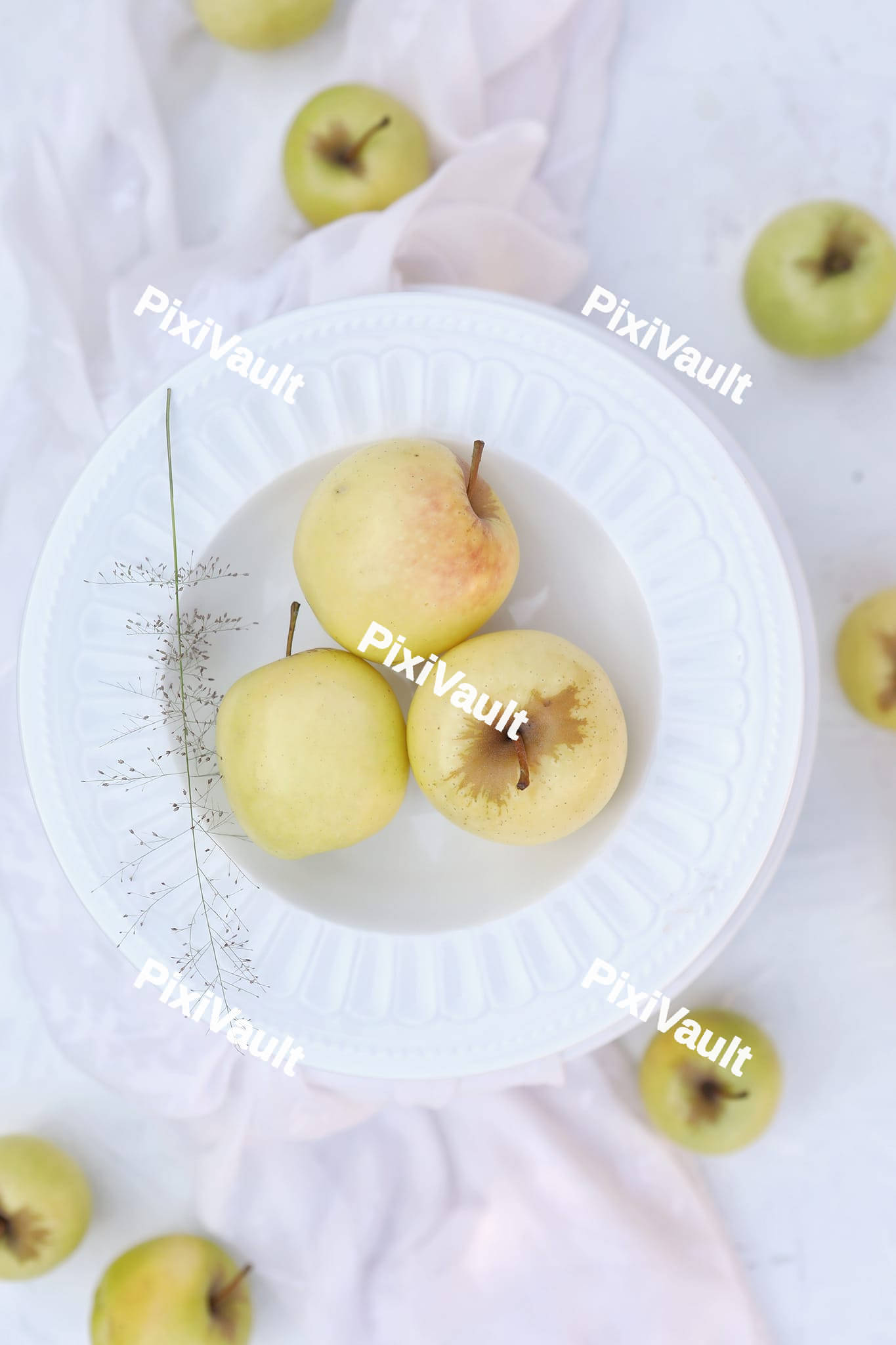 Golden apples inside a plate